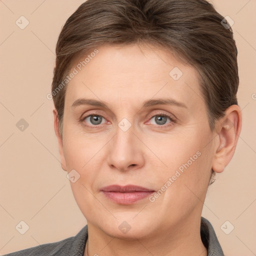 Joyful white adult female with short  brown hair and grey eyes