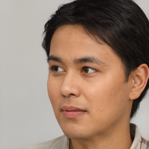 Neutral asian young-adult male with short  black hair and brown eyes