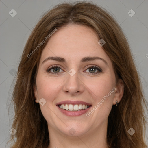 Joyful white young-adult female with long  brown hair and green eyes