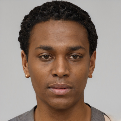 Neutral black young-adult male with short  black hair and brown eyes