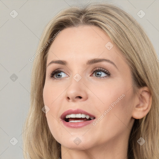 Joyful white young-adult female with long  brown hair and grey eyes