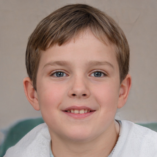 Joyful white child male with short  brown hair and grey eyes