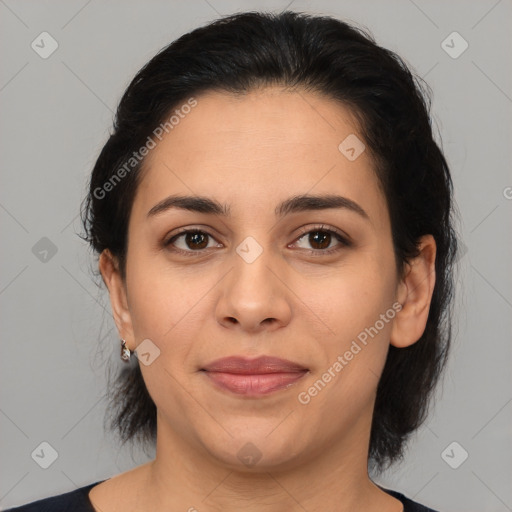 Joyful latino young-adult female with medium  brown hair and brown eyes