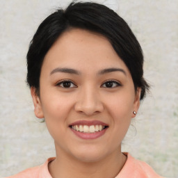 Joyful asian young-adult female with short  black hair and brown eyes