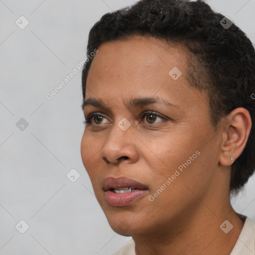 Joyful black young-adult female with short  brown hair and brown eyes