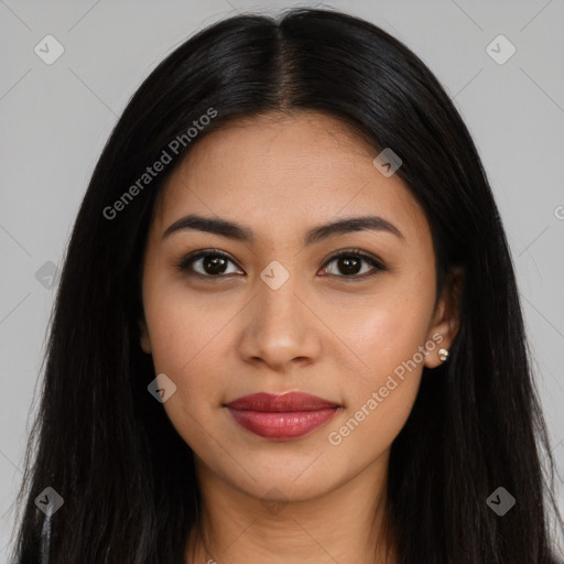 Joyful latino young-adult female with long  brown hair and brown eyes