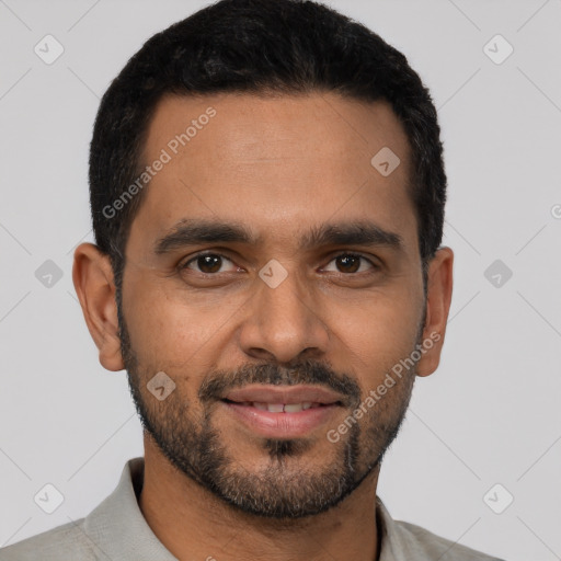 Joyful latino young-adult male with short  black hair and brown eyes