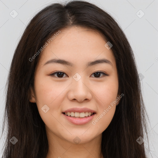 Joyful asian young-adult female with long  brown hair and brown eyes