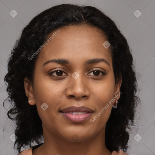 Joyful black young-adult female with long  brown hair and brown eyes