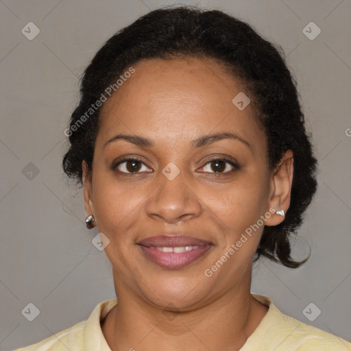 Joyful black adult female with short  brown hair and brown eyes