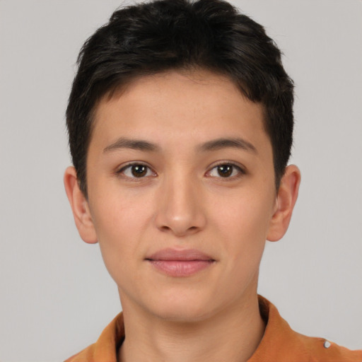 Joyful asian young-adult female with short  brown hair and brown eyes