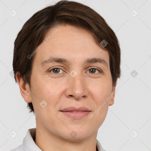 Joyful white adult male with short  brown hair and grey eyes