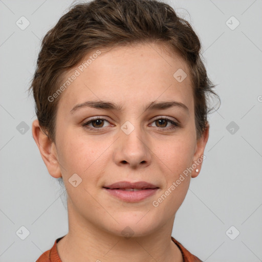 Joyful white young-adult female with short  brown hair and grey eyes