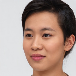 Joyful asian young-adult female with short  brown hair and brown eyes