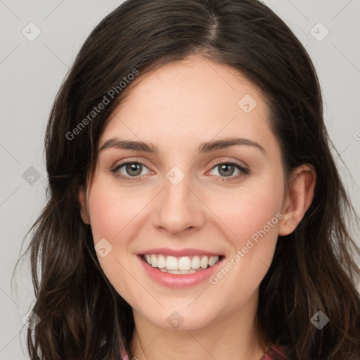 Joyful white young-adult female with long  brown hair and green eyes