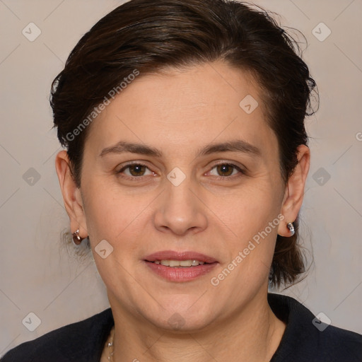 Joyful white adult female with medium  brown hair and brown eyes