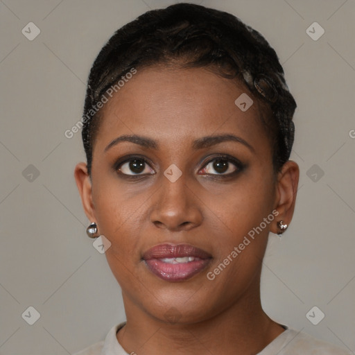 Joyful black young-adult female with short  black hair and brown eyes