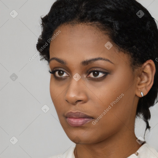 Neutral black young-adult female with short  black hair and brown eyes