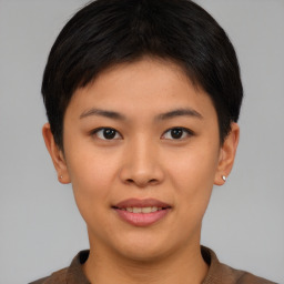 Joyful asian young-adult female with short  brown hair and brown eyes