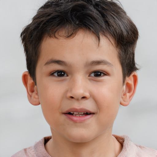 Joyful white child male with short  brown hair and brown eyes