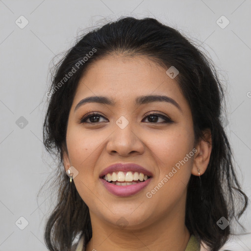 Joyful latino young-adult female with long  brown hair and brown eyes