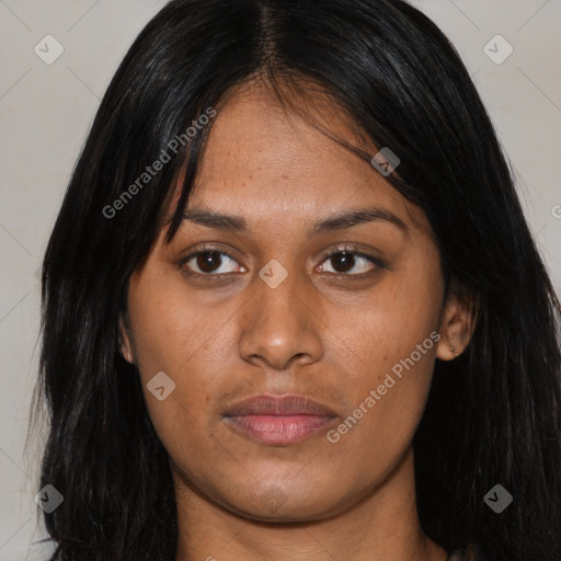 Joyful latino young-adult female with long  brown hair and brown eyes