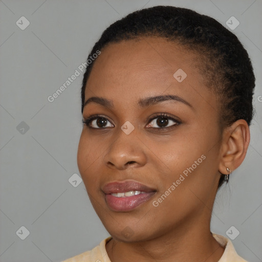 Joyful black young-adult female with short  brown hair and brown eyes