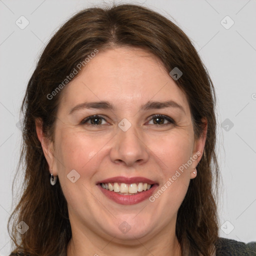 Joyful white adult female with medium  brown hair and grey eyes