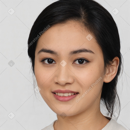 Joyful asian young-adult female with medium  black hair and brown eyes