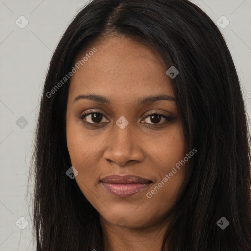 Joyful black young-adult female with long  brown hair and brown eyes