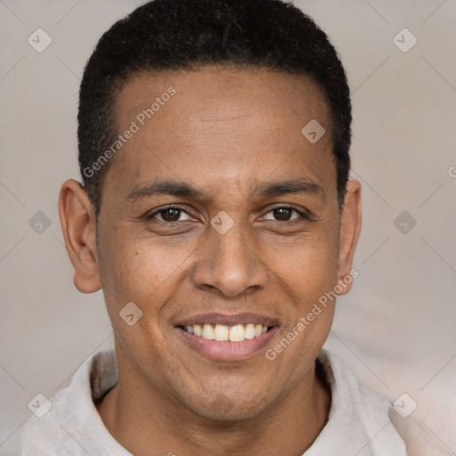 Joyful latino young-adult male with short  brown hair and brown eyes