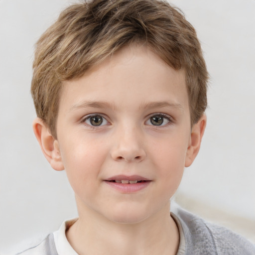 Joyful white child male with short  brown hair and brown eyes