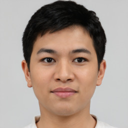 Joyful latino young-adult male with short  brown hair and brown eyes