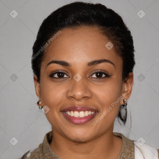 Joyful black young-adult female with short  black hair and brown eyes