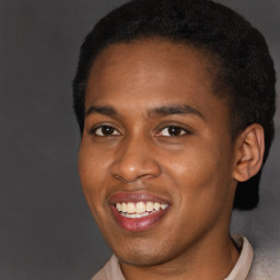 Joyful black young-adult male with short  brown hair and brown eyes