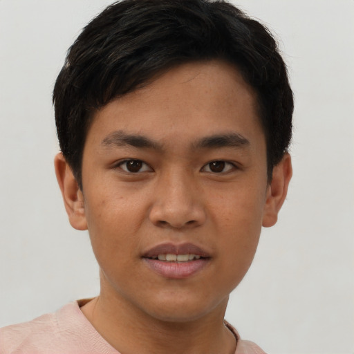 Joyful asian young-adult male with short  brown hair and brown eyes
