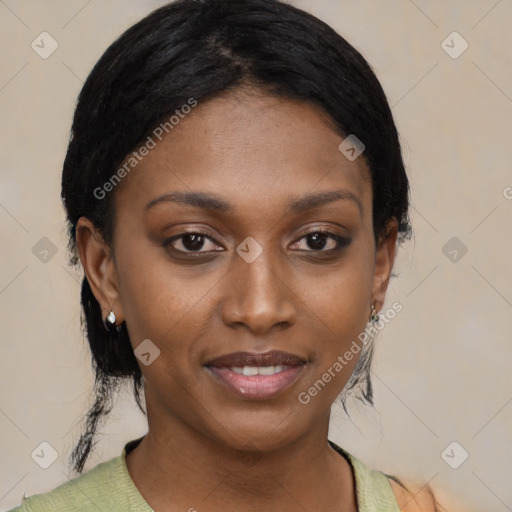 Joyful black young-adult female with medium  black hair and brown eyes