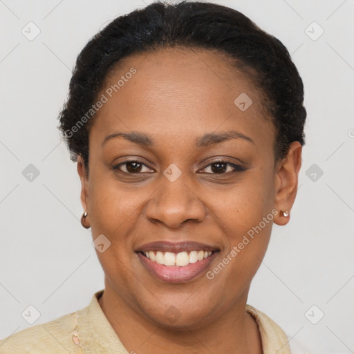 Joyful latino adult female with short  brown hair and brown eyes