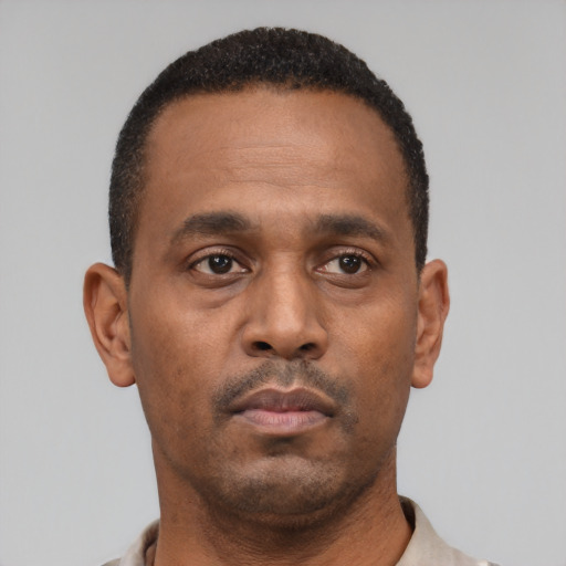 Neutral latino young-adult male with short  brown hair and brown eyes