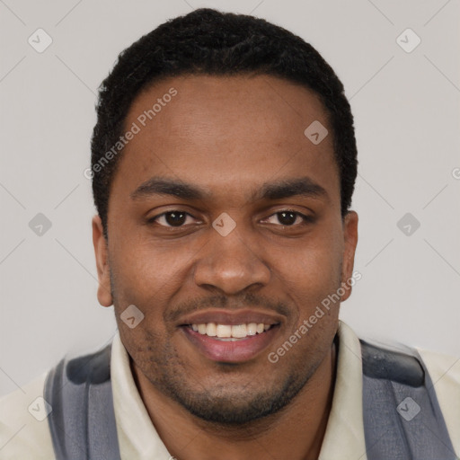 Joyful black young-adult male with short  black hair and brown eyes