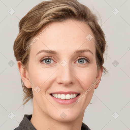 Joyful white young-adult female with medium  brown hair and blue eyes