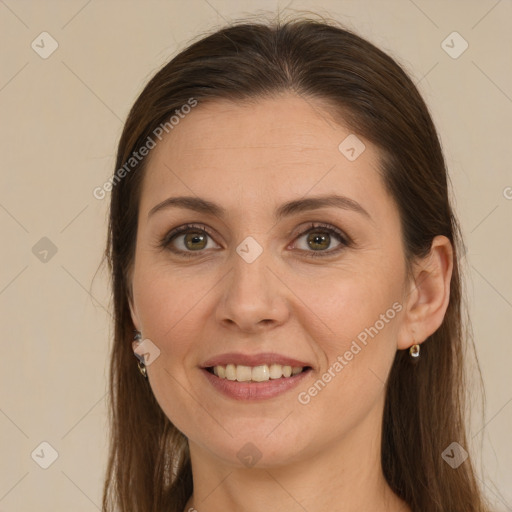 Joyful white young-adult female with long  brown hair and brown eyes