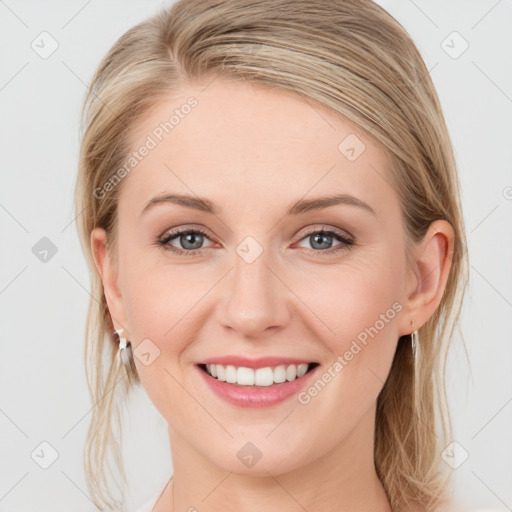 Joyful white young-adult female with medium  brown hair and blue eyes