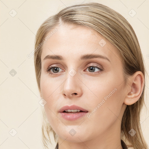 Joyful white young-adult female with long  brown hair and blue eyes