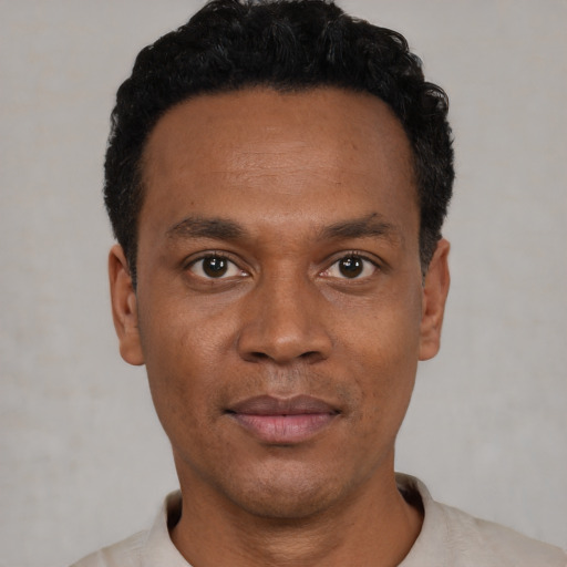 Neutral black young-adult male with short  black hair and brown eyes