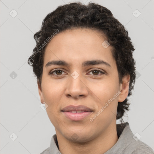 Joyful latino young-adult male with short  brown hair and brown eyes