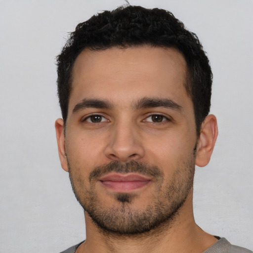 Neutral latino young-adult male with short  black hair and brown eyes