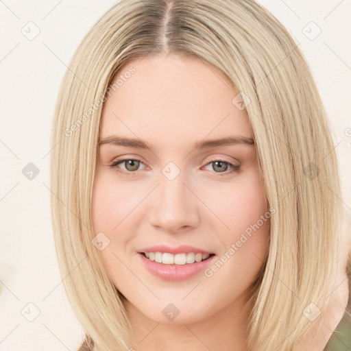 Joyful white young-adult female with long  brown hair and green eyes