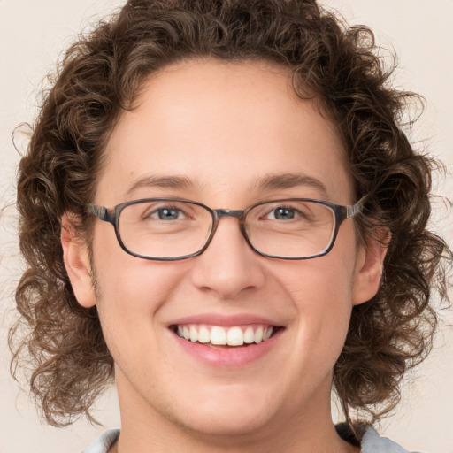 Joyful white young-adult female with medium  brown hair and green eyes