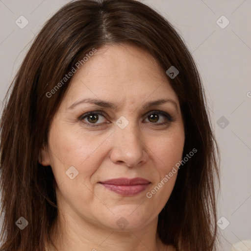 Joyful white adult female with long  brown hair and brown eyes